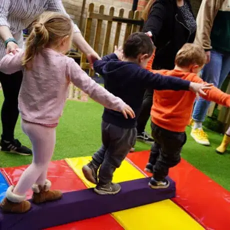 Nursery children learning to balance Nursery children learning to balance