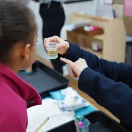 Nursery child taking part in science experiment Nursery child taking part in science experiment