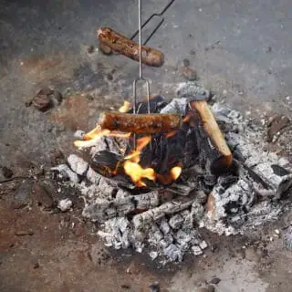 Cooking sausages on a fire pit Cooking sausages on a fire pit