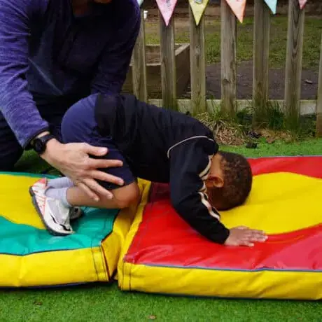 Nursery child learning to roll Nursery child learning to roll